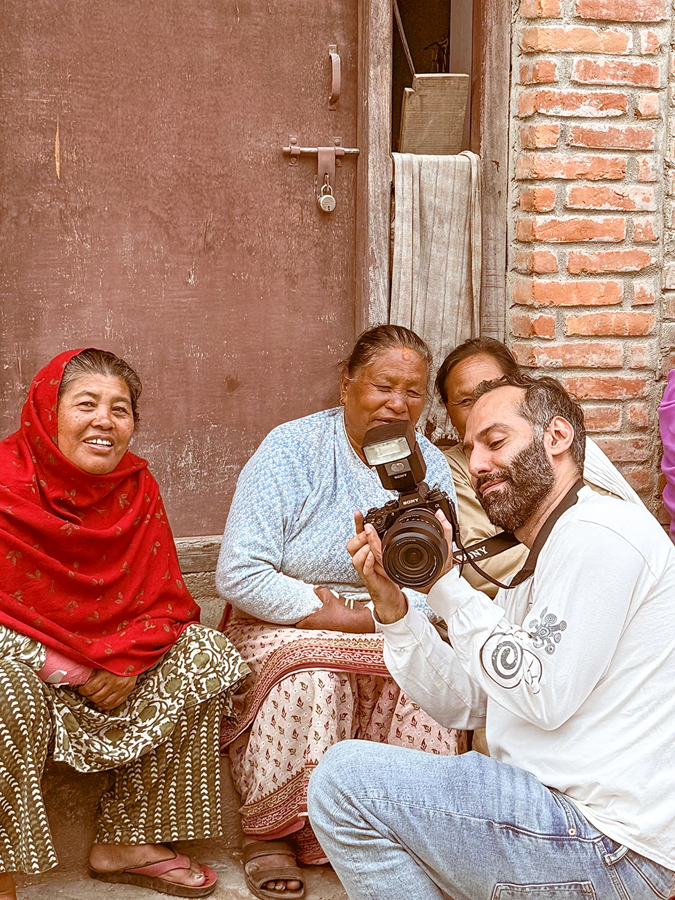Hossein Fardinfard sharing a camera with subjects